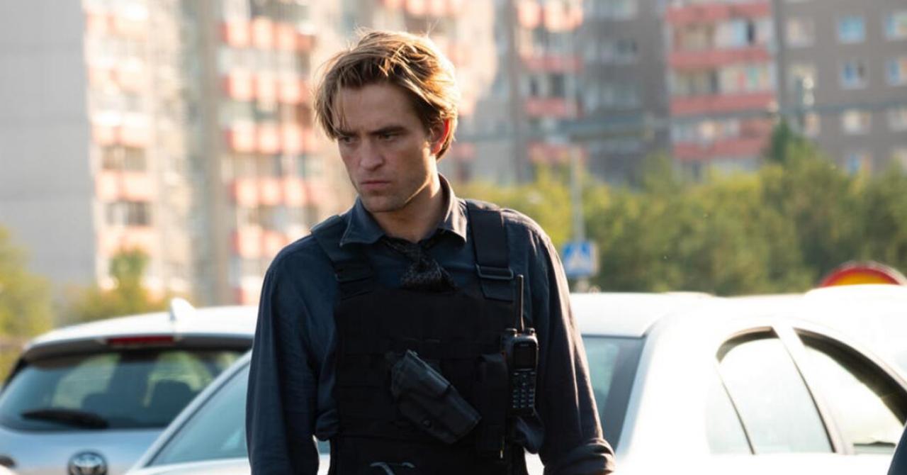 A French beer is offered Robert Pattinson and the director of The Brutalist